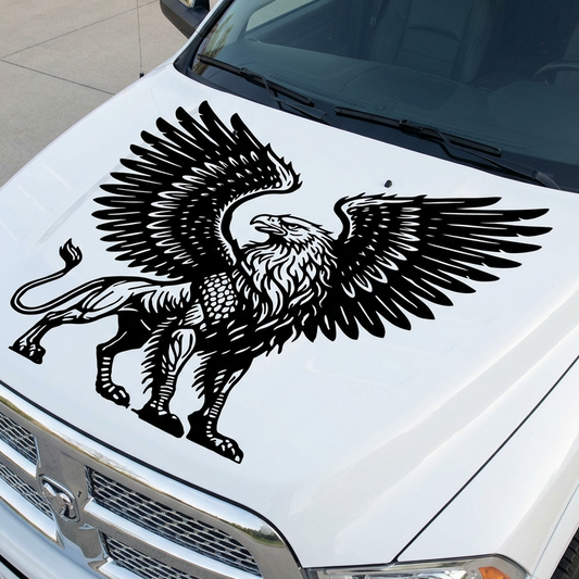 Large black griffin vinyl decal with spread wings applied to the hood of a white truck, featuring a detailed eagle and lion hybrid design