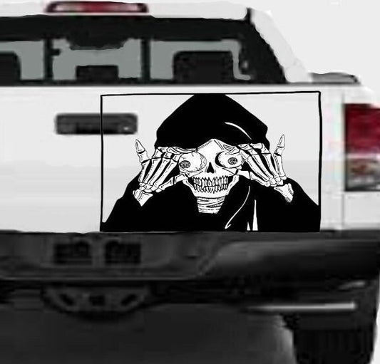 “Black matte Grim Reaper skull decal, 34×23, applied to smooth tailgate”