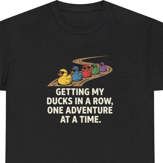 Black t-shirt with colorful ducks graphic and text on a white background
