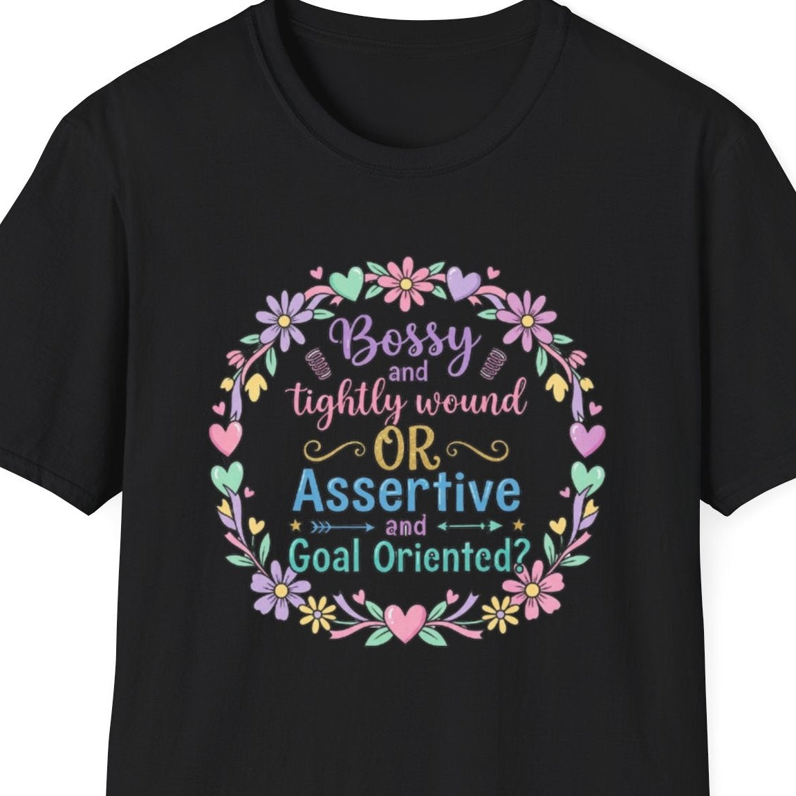 Black t-shirt with colorful text and floral design on a white background