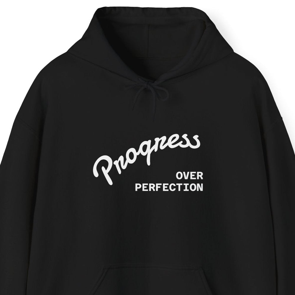 “Progress Over Perfection" minimal‑script hoodie, Black, unisex S–5XL, kangaroo pocket and color‑matched drawcord