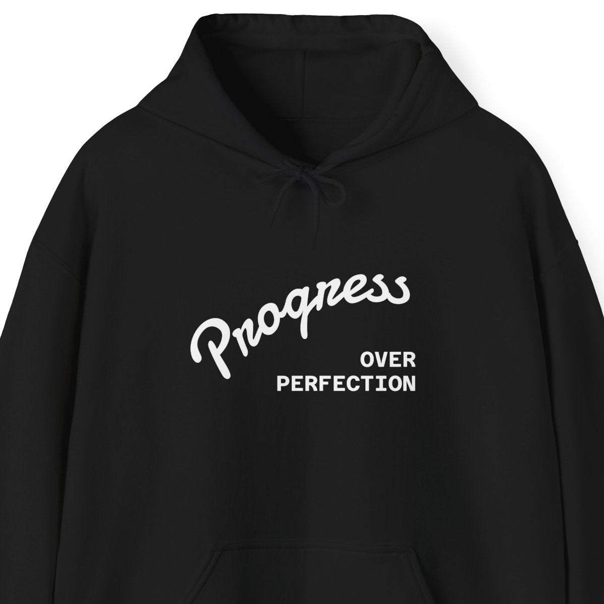 Black hoodie with 'Progress Over Perfection' text on a white background