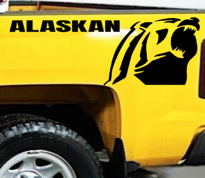 Yellow pickup truck with a Chevrolet Alaskan Black vinyl decal, die-cut