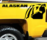 Yellow pickup truck with a Chevrolet Alaskan Black vinyl decal, die-cut
