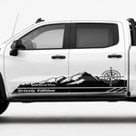 Black mountain compass rocker panel vinyl decal with Grizzly Edition text on white Chevy ZR2 truck