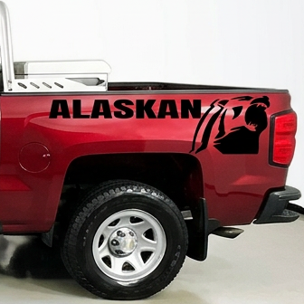 Red  pickup truck with a Chevrolet Alaskan Black vinyl decal, die-cut