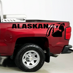 Red  pickup truck with a Chevrolet Alaskan Black vinyl decal, die-cut