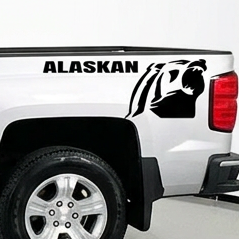 Silver  pickup truck with a Chevrolet Alaskan Black vinyl decal, die-cut