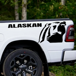 White pickup truck with a Chevrolet Alaskan Black vinyl decal, die-cut