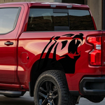 Alaskan bear head in black vinyl on red truck