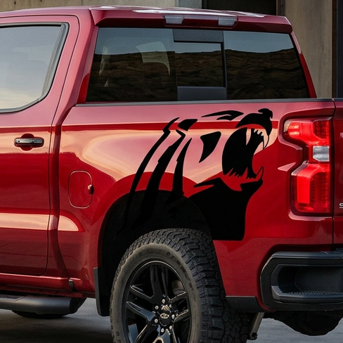 Alaskan bear head in black vinyl on red truck