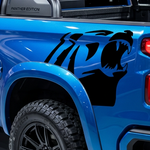 Alaskan bear head in black vinyl on blue truck