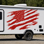 Distressed red American flag vinyl decal displayed across the side of a white camper
