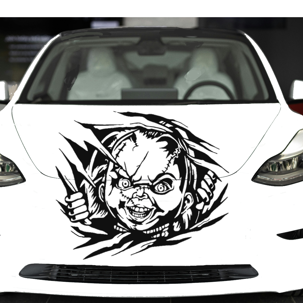 Car with a graphic design on the front, featuring a face and feathers.