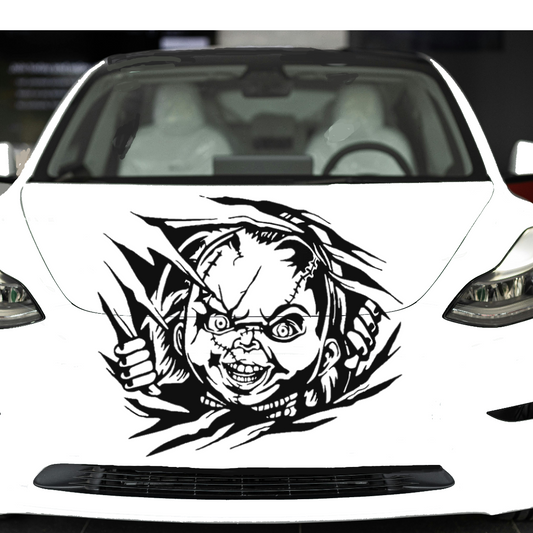 Car with a graphic design on the front, featuring a face and feathers.
