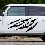 Black claw mark mountain and pine tree vinyl decal displayed on a white Ford Bronco-style truck