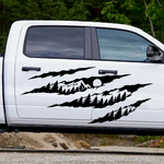 Black claw mark mountain and pine tree vinyl decal displayed on a white  truck