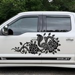 Black cobra snake and flower vine vinyl decal on the side door of a white Shelby truck