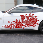 Red cobra snake and flower vine vinyl decal on the side door of a white Mustang