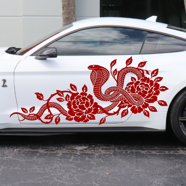 Red cobra snake and flower vine vinyl decal on the side door of a white Mustang