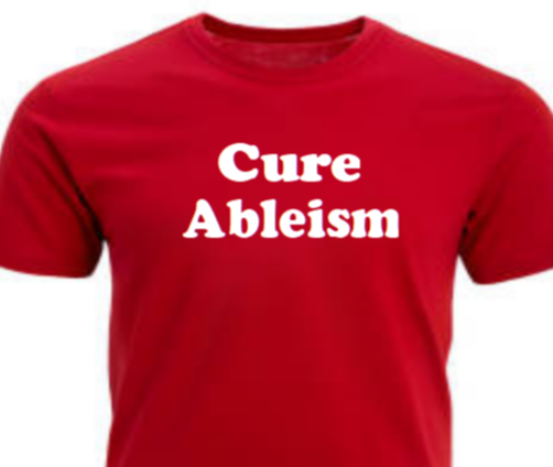 Cure Ableism tee, red shirt with black vinyl text, flat lay”