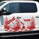 A white Ford pickup truck parked outdoors on a driveway, featuring a red dragonfly and reeds graphic decal applied along the side door.