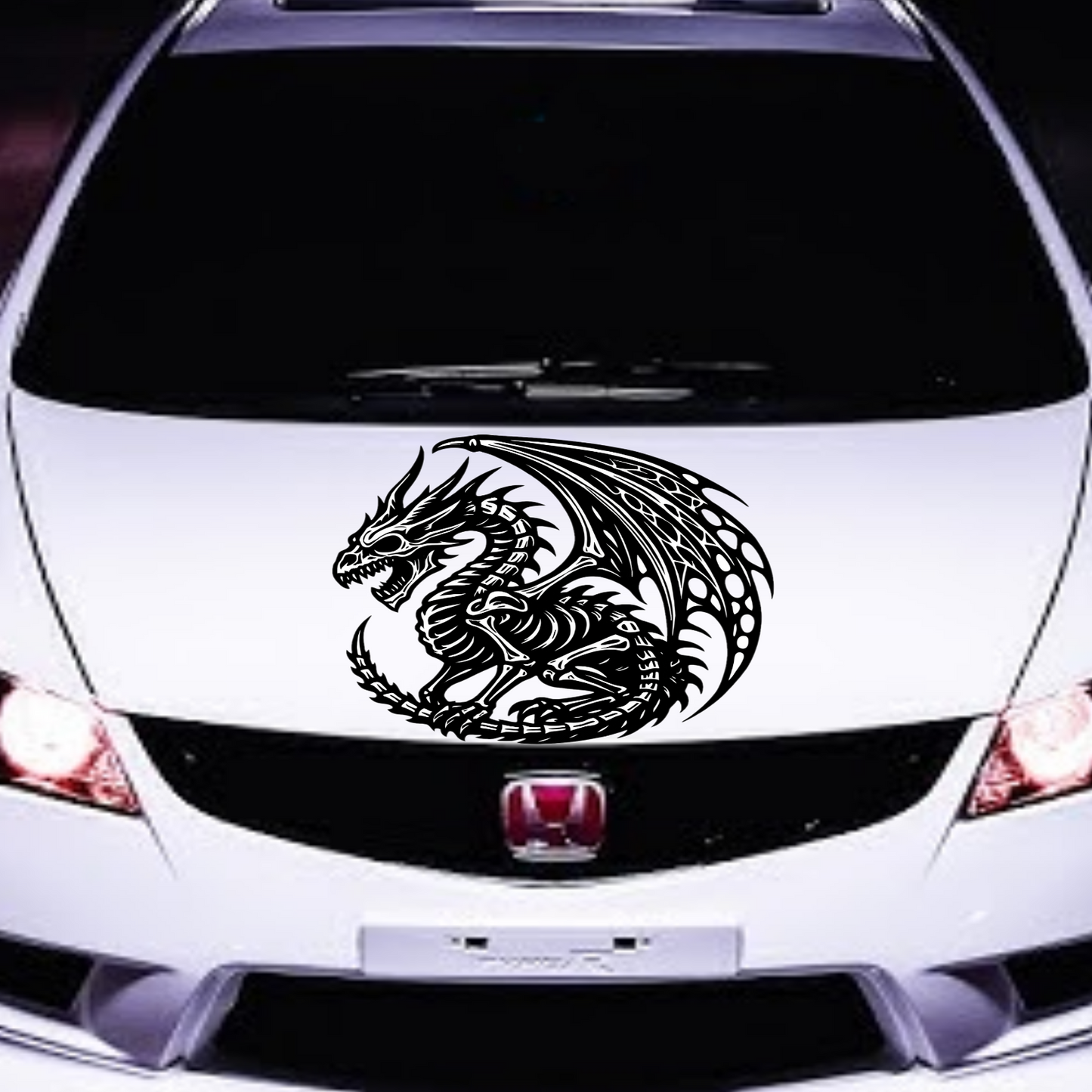 White car with a dragon decal on the hood