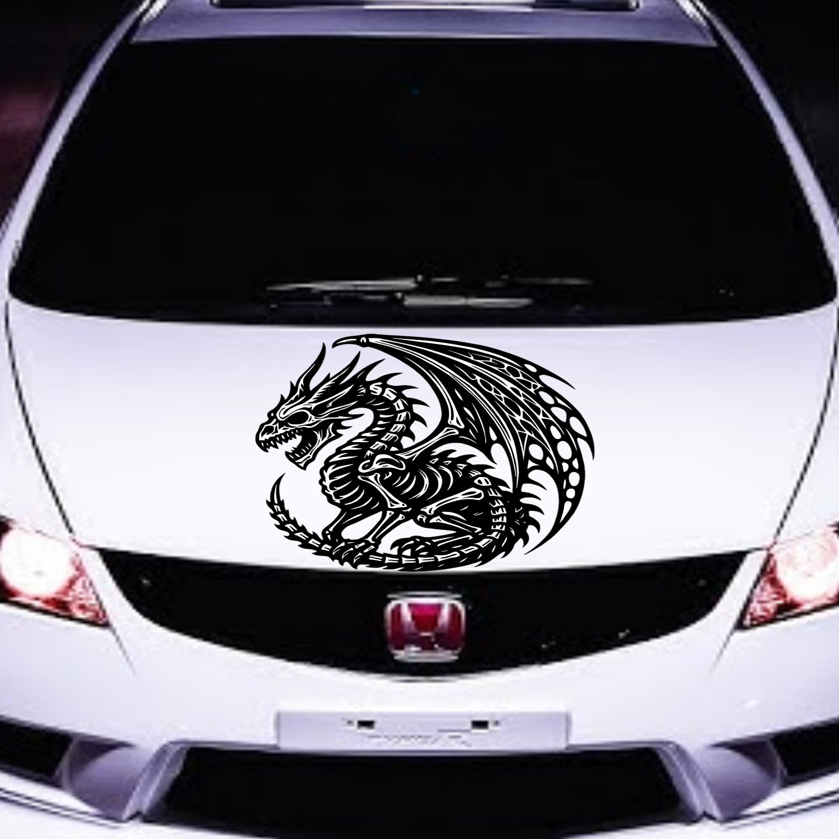 White car with a dragon decal on the hood
