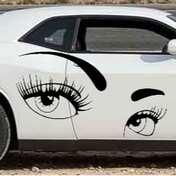 Car with eye and eyelash decals on a white background