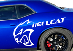 A blue Dodge Challenger with a large white Hellcat cat head logo and the word 'HELLCAT' printed on the side, shown against a plain white background.