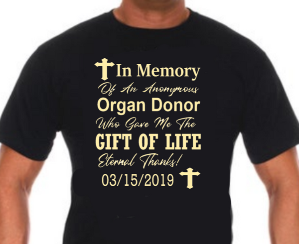 “Organ donor tribute tee, black shirt with yellow vinyl text, personalized transplant date, flat lay”