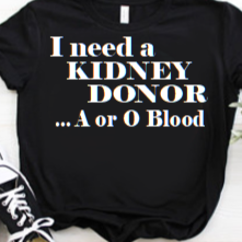 “I Need a Kidney Donor unisex graphic t‑shirt, black with white HTV text, front view”
