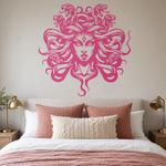 Medusa vinyl decal in pink vinyl on bedroom wall.