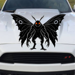 Mothman car decal in black on a white car hood, winged cryptid with antennae and clawed feet