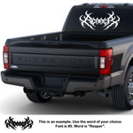 Black truck with a decorative decal on the back window