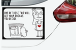 A rectangular black-and-white car decal sticker applied to the rear side of a white car, showing a cartoon figure with a red heart and the text, 'ONE OF THESE TWO WILL GET YOUR ORGANS, YOU DECIDE.' A red car taillight is visible on the right side of the image.