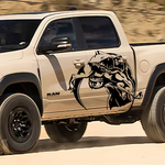 T-rex eating raptor vinyl decal on tan truck