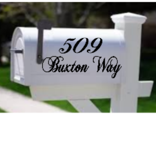 White mailbox with black text displaying a address on a white background