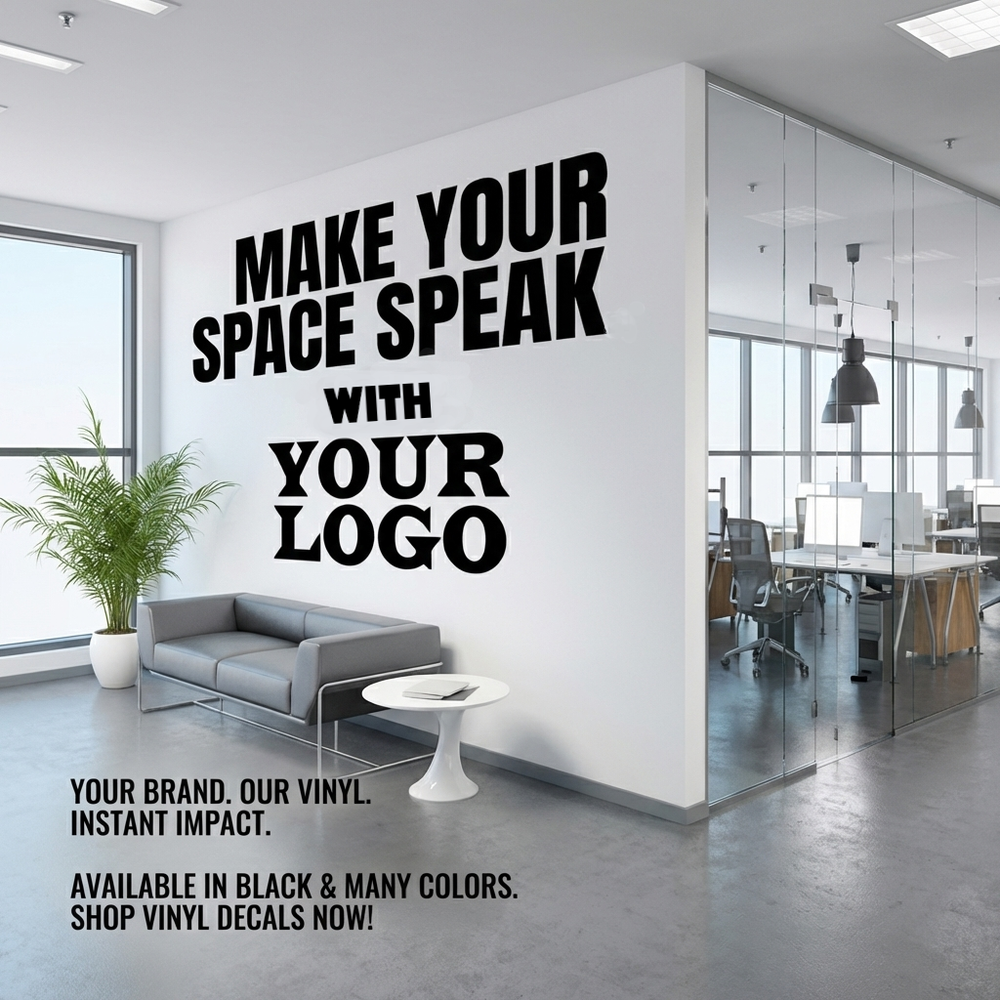 A large black vinyl wall decal mockup displayed on a white office wall. The text reads 'MAKE YOUR SPACE SPEAK WITH YOUR LOGO