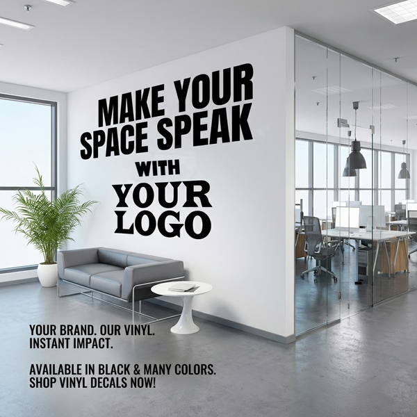 A large black vinyl wall decal mockup displayed on a white office wall. The text reads 'MAKE YOUR SPACE SPEAK WITH YOUR LOGO