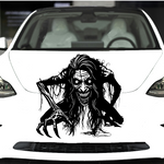 “Zombie/Banshee ‘Black Annis’ vinyl hood decal, white, die‑cut with no background on green car”