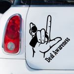 A black vinyl decal showing the ASL "I Love You" hand sign combined with a cochlear implant graphic, and the words "Deaf Awareness" below.