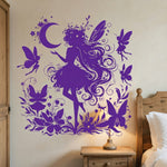 Purple fairy silhouette vinyl decal with moon, butterflies, and flowers on a bedroom wall