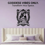 Bedroom with a wall decal featuring a goddess design and text 'Goddess Vibes Only. Transform Your Space.'
