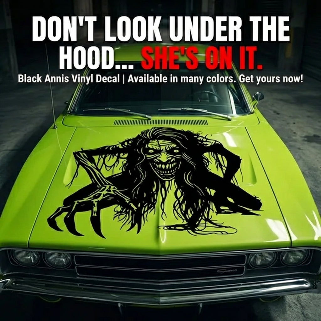 “Zombie/Banshee ‘Black Annis’ vinyl hood decal, white, die‑cut with no background on green car”