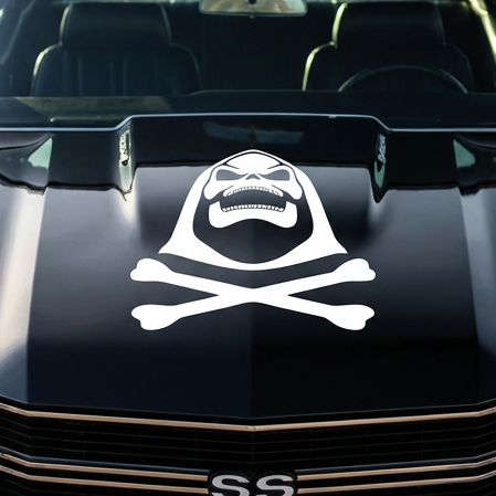 Black muscle car with a white Skeletor Inspired decal on a hood, featuring text 'Bad to the Bone'.