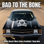 Black muscle car with a white Skeletor Inspired decal on a hood, featuring text 'Bad to the Bone'.