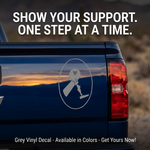 Amputee Ribbon vinyl car decal with text, grey, 10‑inch width on rear of truck”