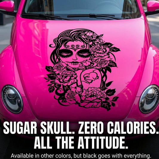 Pink car with a sugar skull design and text on a city street.