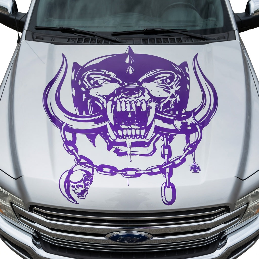 Silver  car with aggressive war pig skull hood decal featuring tusks and chain design